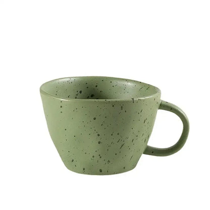 A matte sage green speckled ceramic mug with a rounded handle from the decorbites creative ceramic espresso cup set