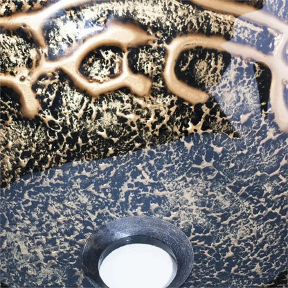 Textured black and gold glass wash basin with circular drain included in a bathroom waterfall faucet basin set