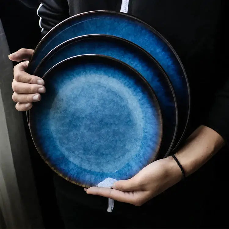 Set of three handcrafted ceramic dinner plates with textured blue gradient glaze and dark brown rim decorbites ceramic dinner