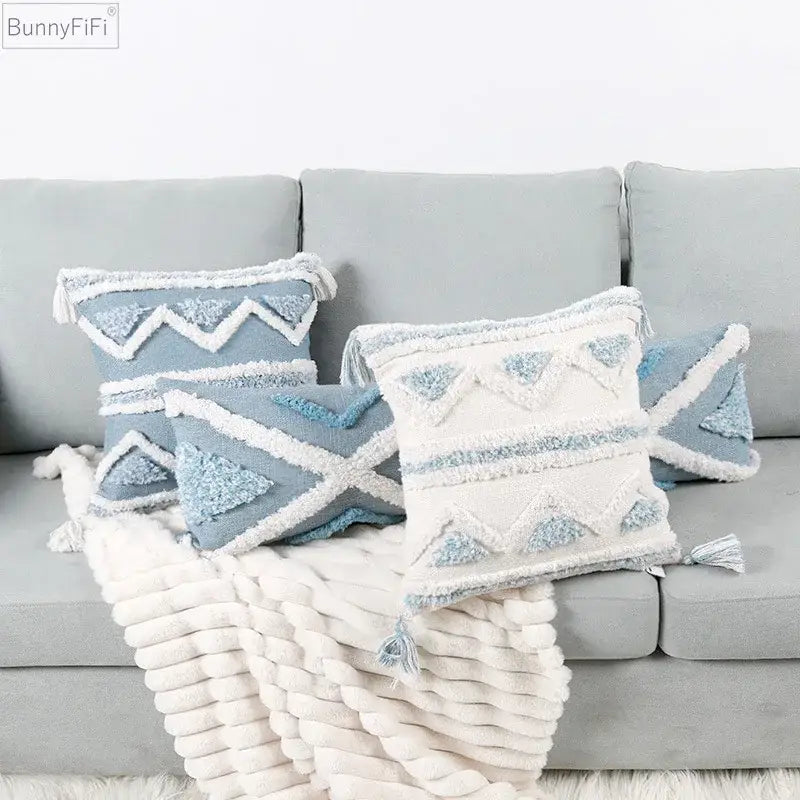 Textured blue and white geometric cushion cover with embroidered decorbites blue geometric design and tassels for living room decor