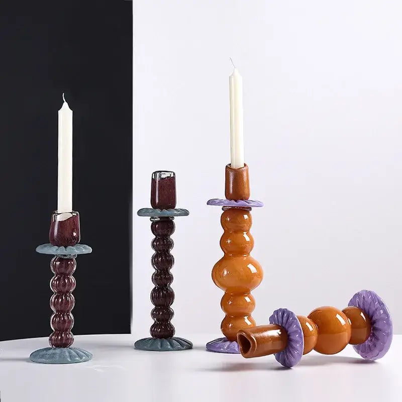 Set of three handcrafted ceramic candlestick holders in burgundy amber and lavender with geometric glass decorbites design