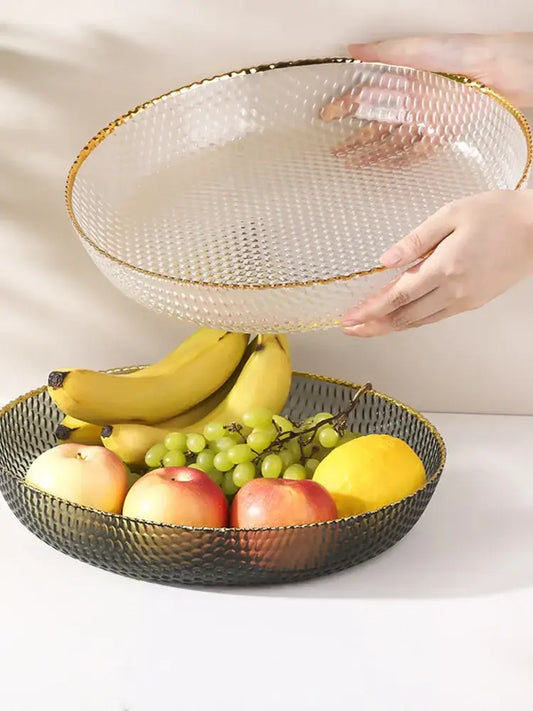 Gold-trimmed clear glass fruit plate with textured surface and black mesh base for snack storage plate use