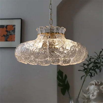 Textured clear glass french pendant chandelier with gold-toned metal chain and rim for dining room lighting