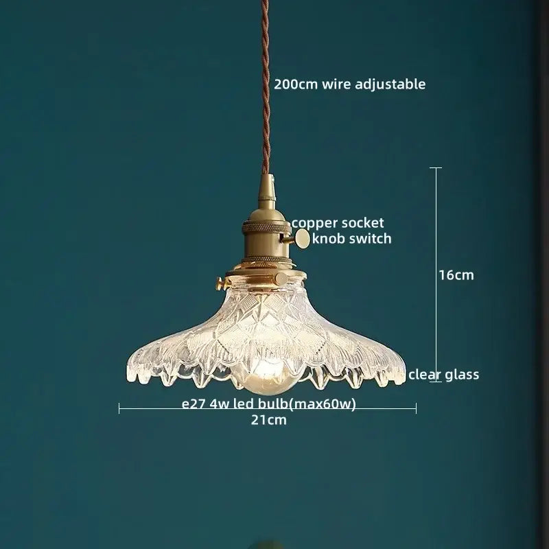 Vintage-style pendant light with a textured clear glass led shade and brass-finished copper socket for kitchen decorbites clear glass fixture