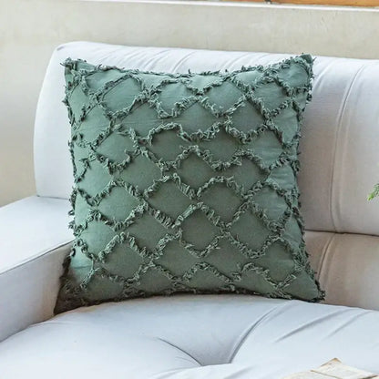 A sage green cotton diamond cushion cover with textured frayed diamond pattern from decorbites for living room decor