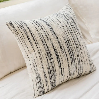 A cozy cream and black striped comfort woolen pillow cover by decorbites for living room decor
