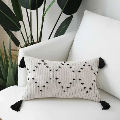 Beige cushion cover with black embroidered dots and tassels featuring decorbites geometric tassels design for living room decor