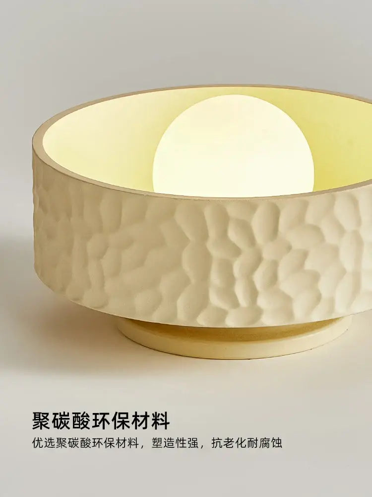 Cream ceiling light featuring a textured cream polycarbonate bowl with gold trim and warm interior light for living room decorbites ceiling light