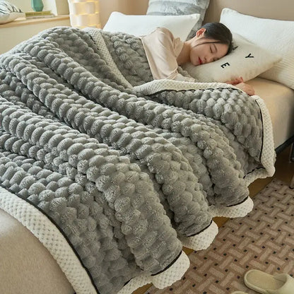 Gray coral fleece warm blanket with textured raised pom-pom pattern and cream-colored border trim by decorbites