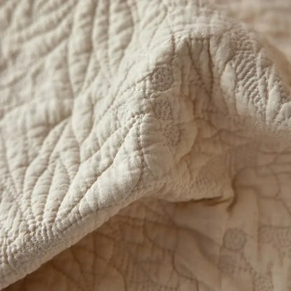 Cream cotton quilted bedspread set with textured surface and subtle pattern featuring fringes for bedroom decorbites cotton quilted
