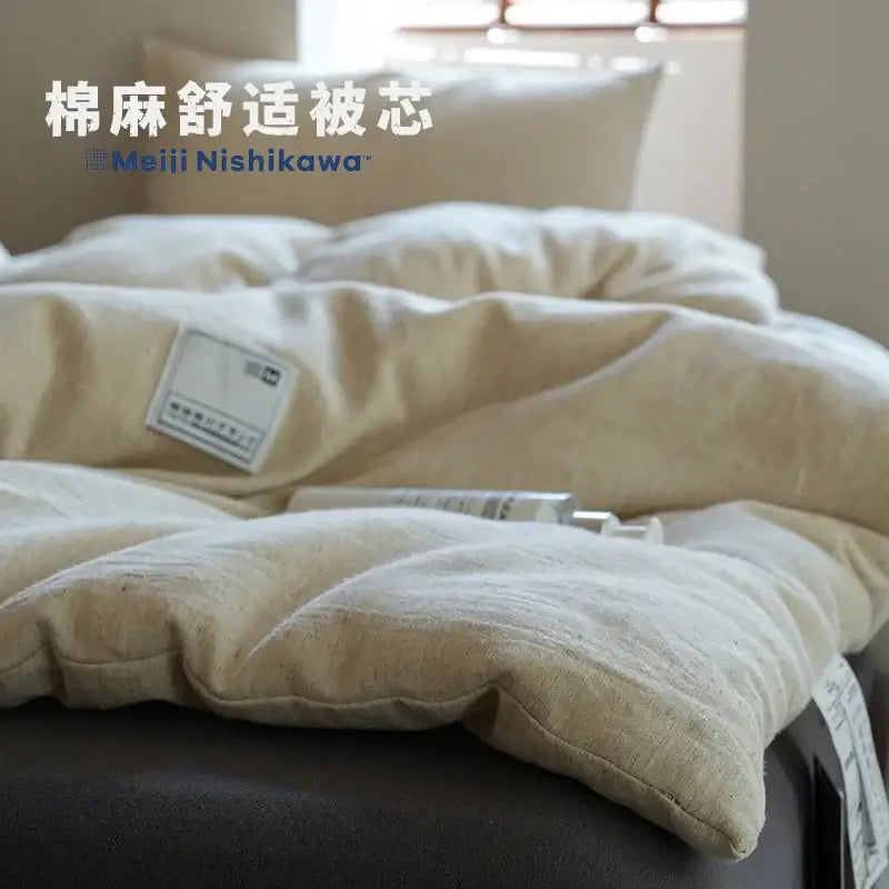 Beige cotton-linen blend comforter insert by meiji nishikawa featured in decorbites linen cotton summer bedroom decor