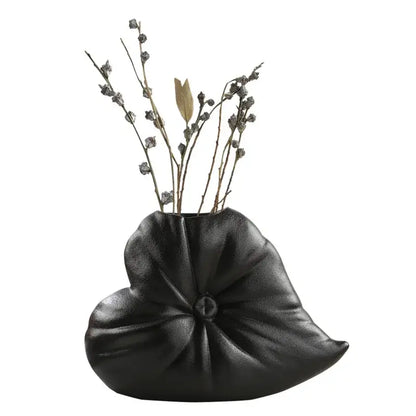 Black ceramic fluffy heart vase shaped like stylized lotus leaf with textured pleated surface for living room decorbites fluffy heart decor