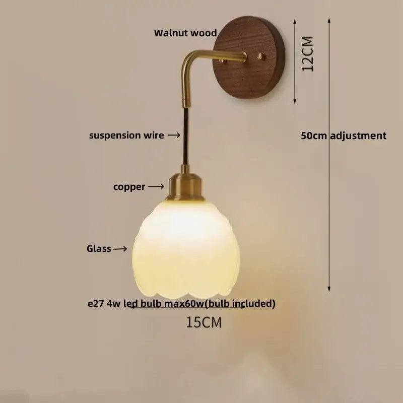 Warm-toned textured glass and walnut wood decorbites adjustable led wall light with curved brass arm bedroom sconce