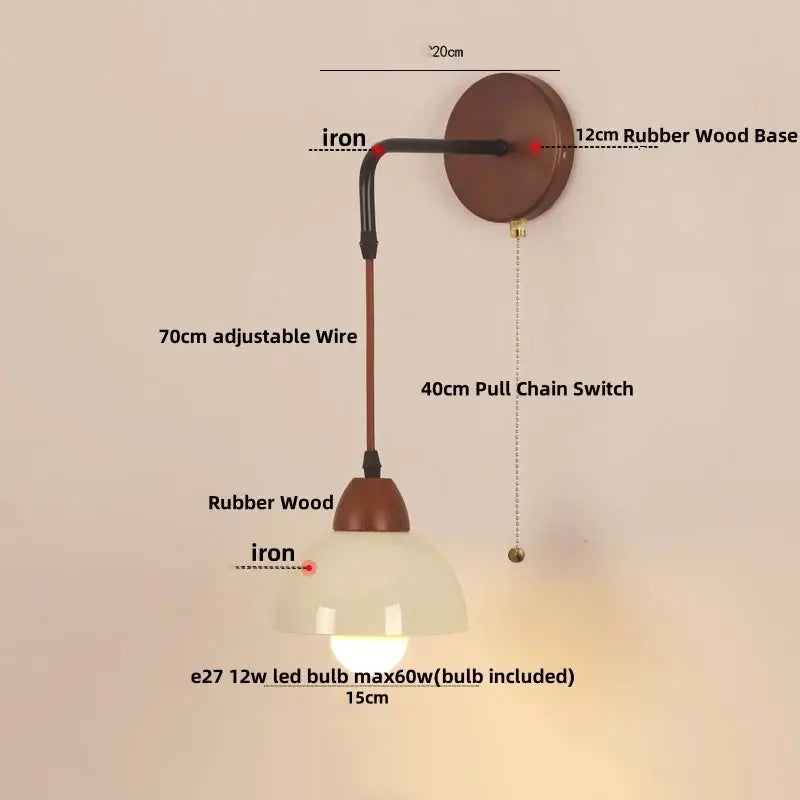 A warm-toned decorbites adjustable led wall light with rustic iron arm rubber wood base and pull chain switch