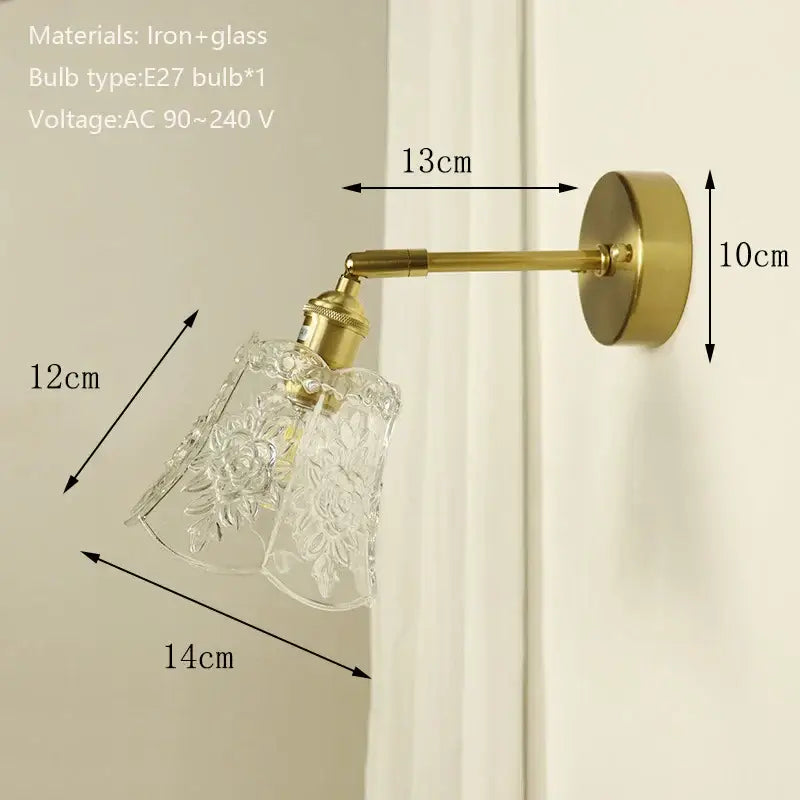 Brass-finished wall sconce with clear etched floral glass shade featuring decorbites brass mirror for bedroom decor