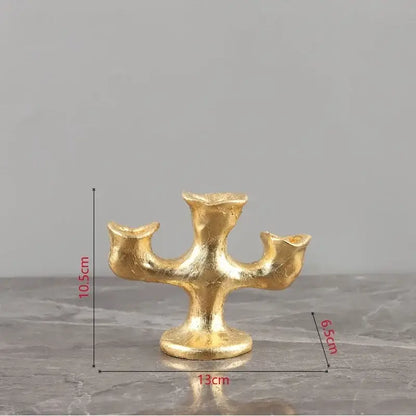 Golden textured candelabra candle holder with three arms on a sturdy base for decorbites gold resin candle decor