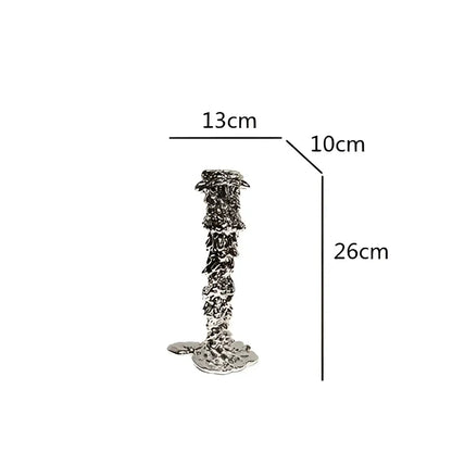 Silver metallic candlestick holder with textured layered design and flared base by decorbites golden candlestick holder