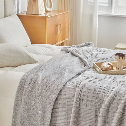 Textured gray coral fleece blanket with a soft fuzzy surface and woven pattern ideal as a cozy fleece blanket throw