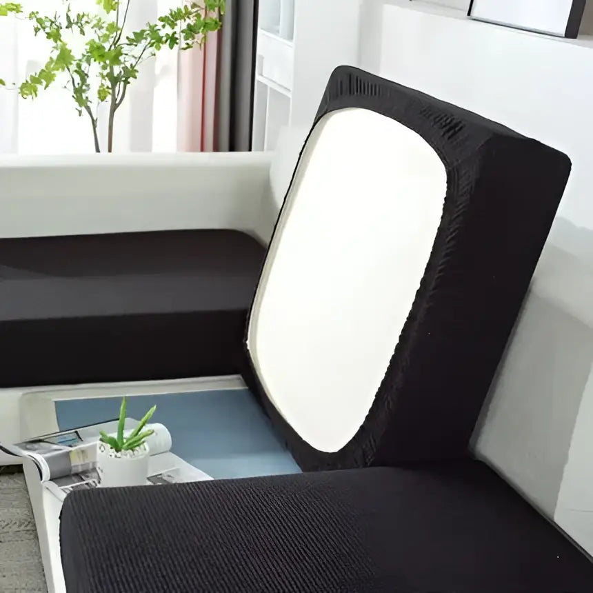 Black textured fabric sofa cover with white panel on backrest for living room furniture protection