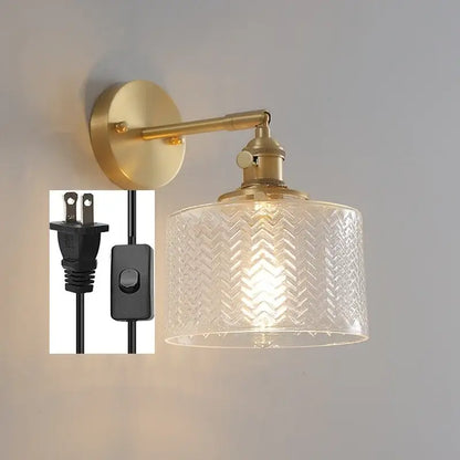Gold-finished wall sconce with clear glass nordic shade featuring embossed chevron pattern for bedroom lighting