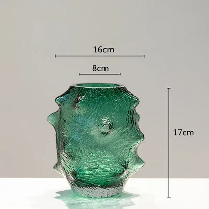 Textured translucent emerald green sea cucumber glass vase with sculpted surface and flared rim for living room decor