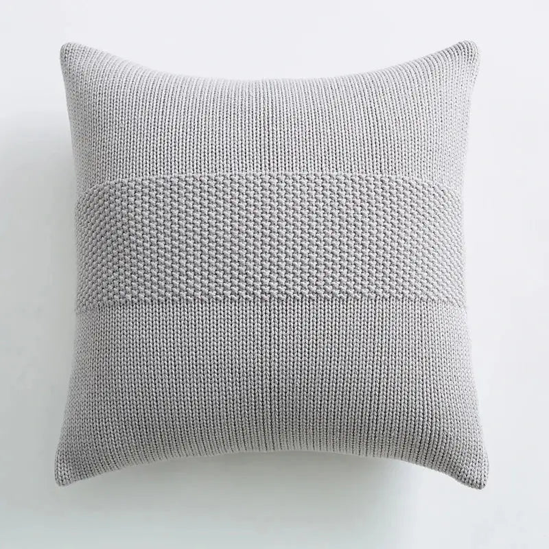 A soft light gray knit cushion cover with textured horizontal stitch patterns for living room decorbites decor