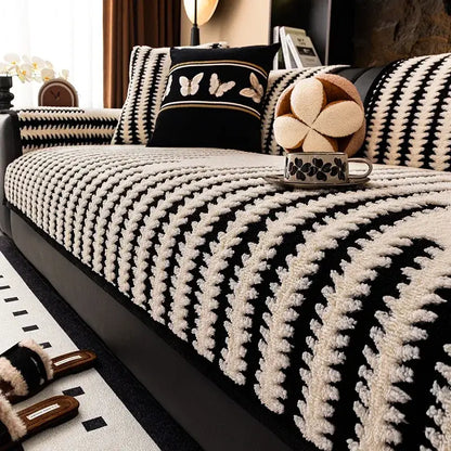 Textured olive and black striped knitted sofa cover with black and cream textured leaf pattern for living room use