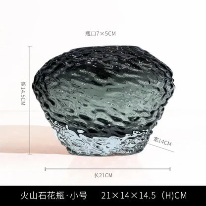 Textured dark green to black glass colored vase with bubbly surface and irregular shape for living room decor