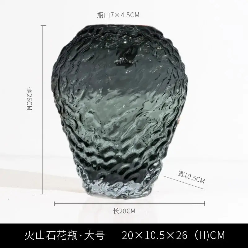 A dark textured orange and yellow glass colored vase with a wavy surface and wider base for living room decor
