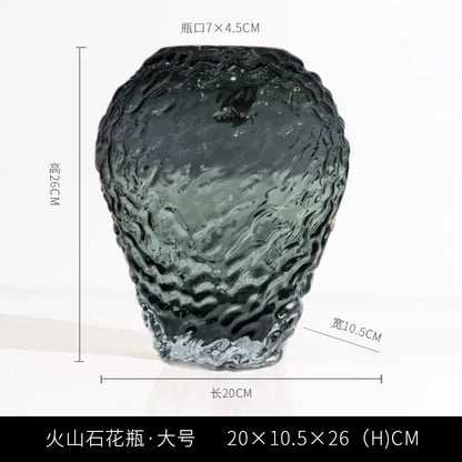 A dark textured orange and yellow glass colored vase with a wavy surface and wider base for living room decor