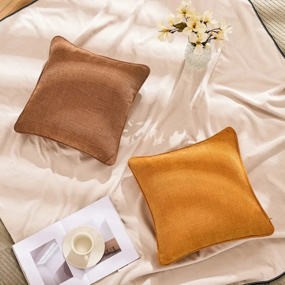 Two square throw pillows in warm brown and mustard yellow with textured cotton linen pillow cover for living room decorbites cotton linen