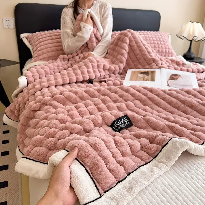 Textured pink and cream cozy flannel velvet blanket with plush quilted surface and decorbites cozy flannel trim
