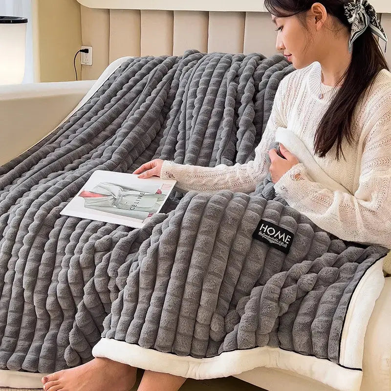 Gray plush throw blanket with ribbed texture and white fleece lining featuring black home patch for cozy flannel velvet decorbites
