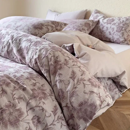 A mauve-toned floral duvet cover with elegant embroidery in a textured soft yellow decorbites cotton bedding set