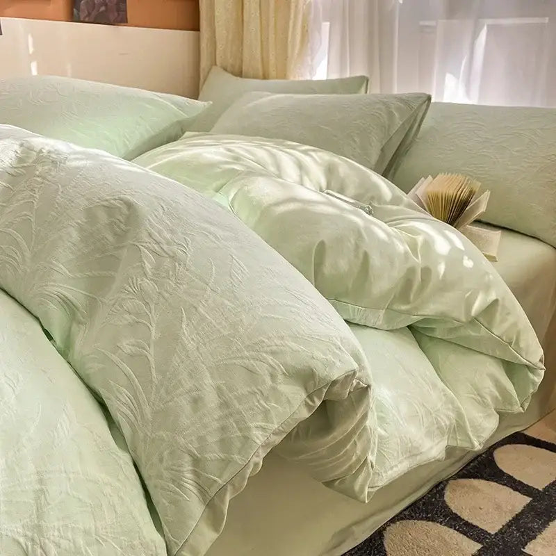 Light green satin duvet cover with subtle floral embroidery in a decorbites cotton three-layer bedding set for bedroom decor