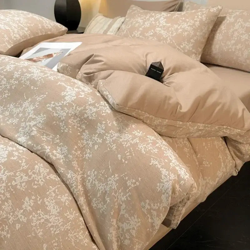 Beige floral-patterned decorbites cotton three-layer bedding set with subtle white blossoms on soft textured fabric