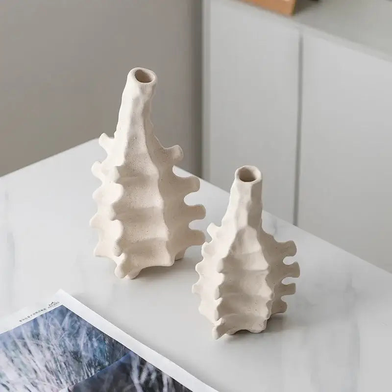 Two off-white decorbites ceramic vases with textured leaf-like ridges for home decor and living room accents