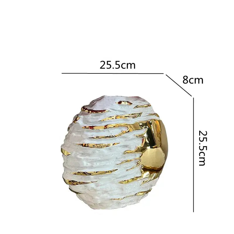 A translucent white textured ceramic vase with gold metallic accents for living room decor by decorbites golden ceramic