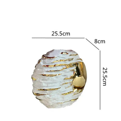 A translucent white textured ceramic vase with gold metallic accents for living room decor by decorbites golden ceramic