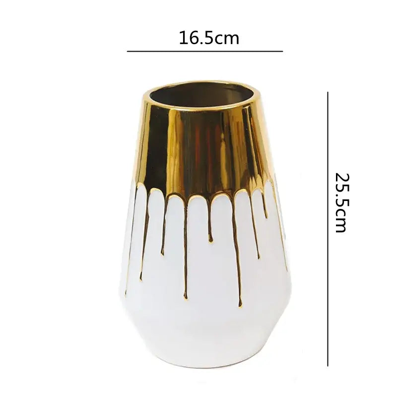 A sleek white and golden ceramic vase with glossy gold drip design and reflective rim for decorbites golden ceramic decor
