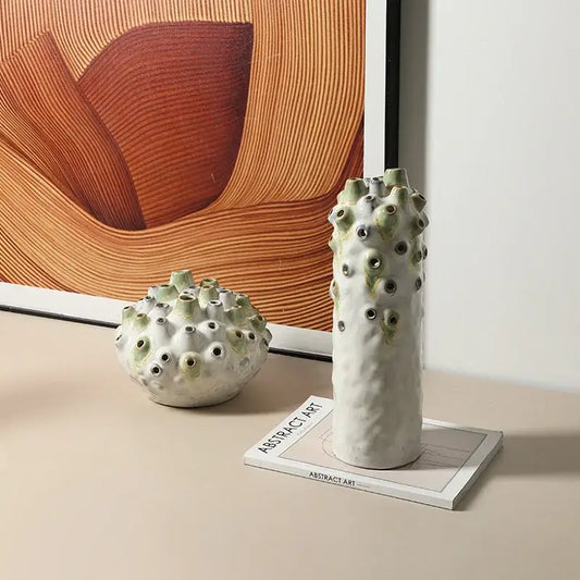 Tall textured white and green coral ball ceramic vase with circular openings for living room decorbites coral ball decor