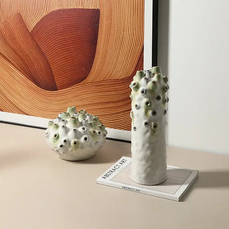 Tall textured white and green coral ball ceramic vase with circular openings for living room decorbites coral ball decor