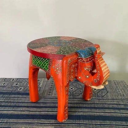 Vibrant red thai style ethnic handmade elephant stool with turquoise mosaic seat and intricate gold green decorbites patterns