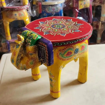Vibrant yellow decorbites handmade elephant stool with red painted top and thai style ethnic patterns for living room decor