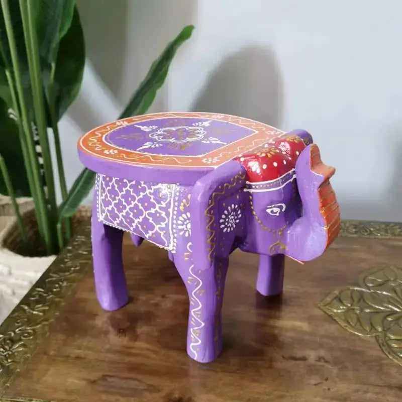 Thai style ethnic decorbites handmade elephant stool in purple wood with white gold floral patterns and red accents for living room decor