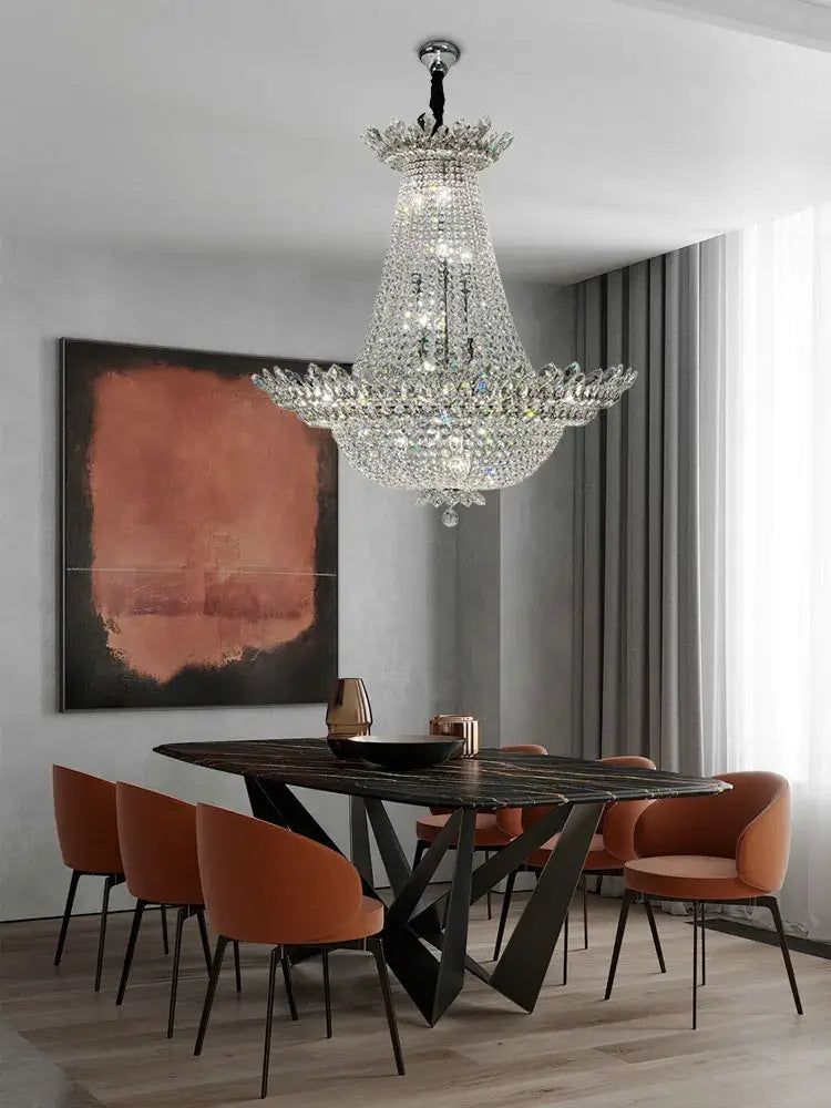 A multi-tiered decorbites k9 crystal chrome led chandelier with clear crystals and black metal frame for living room lighting