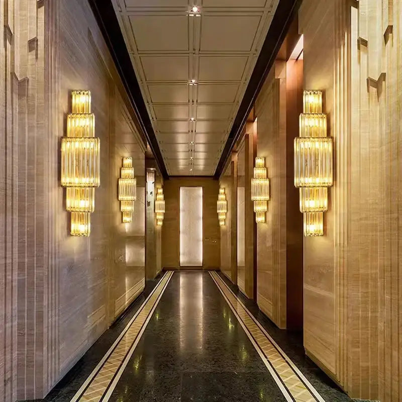 Tiered golden wall lamp with decorbites clear glass and stainless steel in modern art deco style for dining room use