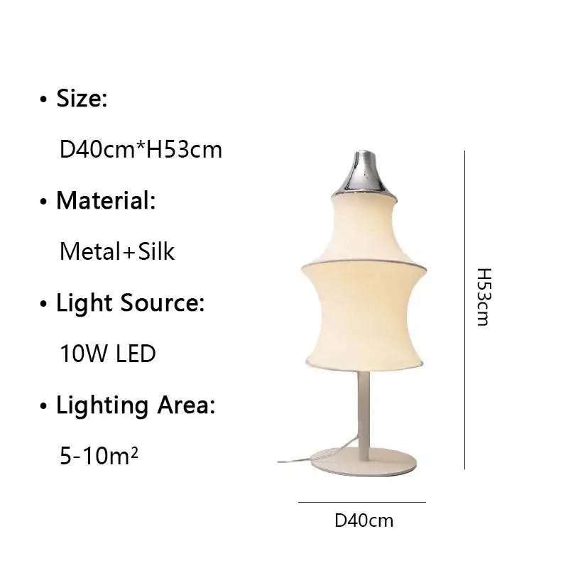 A sleek floor lamp with a metallic base and tiered cream silk japanese shade for soft living room lighting decorbites cream silk