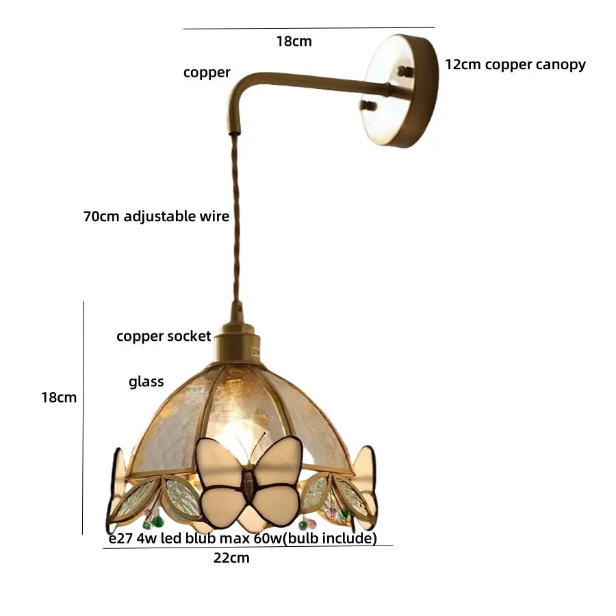 Antique brass-finished copper wall lamp with tiffany butterfly glass shade featuring butterfly and leaf details by decorbites