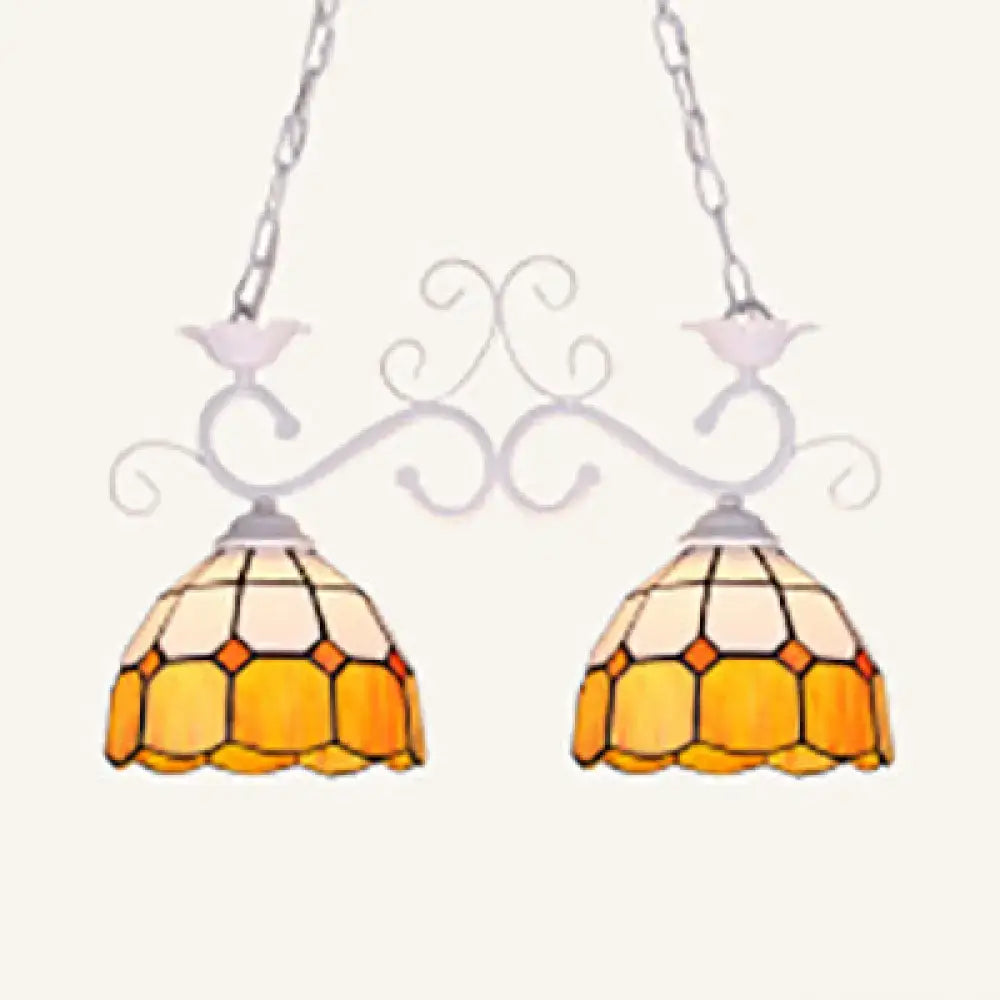 Ornate white metal ceiling light with two amber and cream stained glass shades for stylish dining room lighting